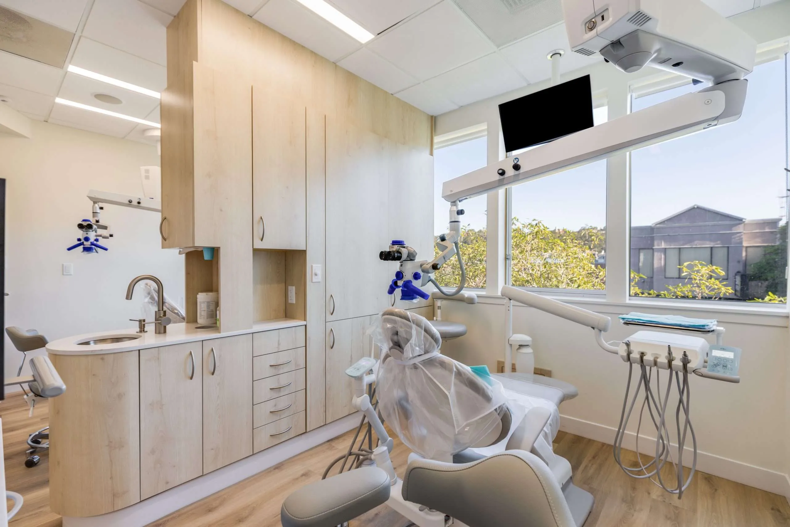 A treatment room with garden views and natural light